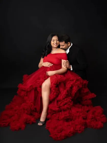 This is what dreams are made of! I love creating these bold, glamorous portraits for moms-to-be. This stunning red gown is part of my client closet, and we used a simple black backdrop in the studio to make the color and the beautiful baby bump truly pop.