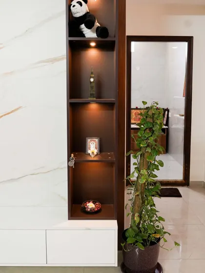 Another angle of the display tower, showing how it provides vertical storage and visual interest next to the sleek, low-profile TV console.