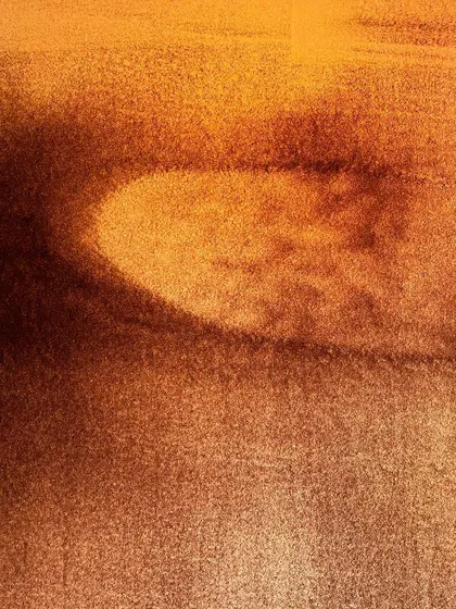 Another abstract from the 'Sand Sangam' series. This image has a soft focus, emphasizing the gentle gradient of the sand and the subtle shapes emerging from the background.