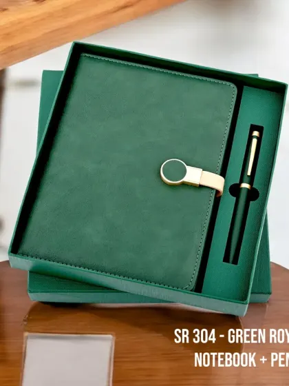 The "Green Royale" notebook and pen set is a classic and elegant corporate gift. The rich green faux-leather diary with a stylish clasp comes paired with a matching pen, all presented in a sophisticated gift box.