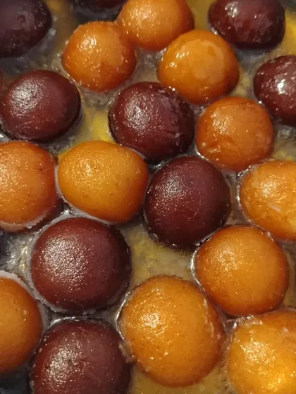 The secret to perfect gulab jamun is letting them soak in just the right amount of syrup. This is a glimpse of our process, ensuring each one is juicy and full of flavour.