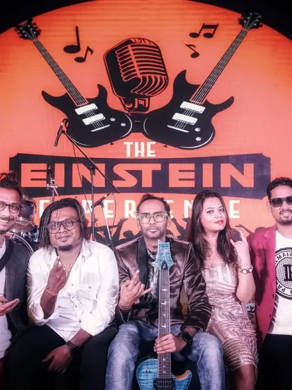 A classic post-performance click with our band branding proudly in the background. We are a professional and established act in the Bangalore music scene.