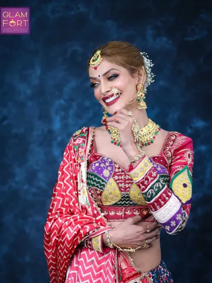A vibrant and traditional look perfect for Navratri. The colorful outfit is matched with equally colorful and festive makeup.