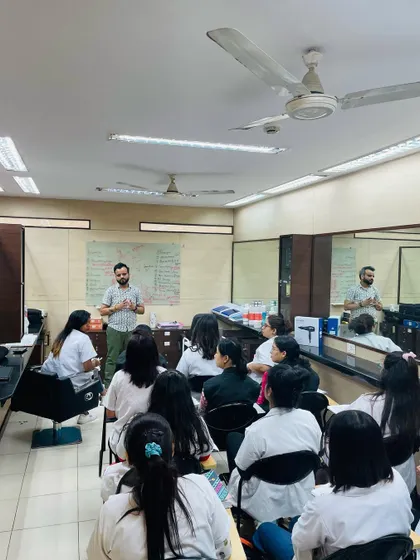 An interactive classroom session in progress. Our students are encouraged to ask questions and engage directly with our trainers to deepen their understanding of hairdressing concepts.