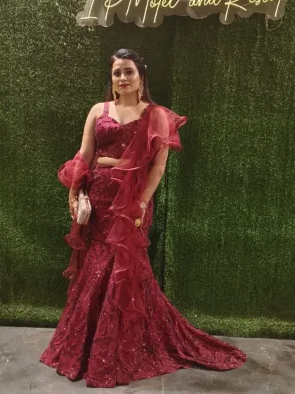A client looking gorgeous in a red ruffled mermaid-style lehenga. This is a fantastic option for a cocktail party or sangeet.