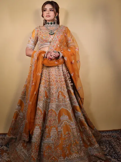 The full 'Marigold Muse' ensemble. The golden-orange lehenga is a perfect match for the warm makeup, creating a stunning, cohesive bridal look that you can learn to create.