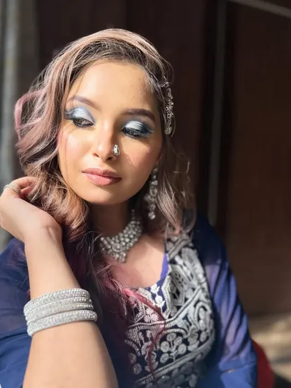 Another angle of the silver cut-crease look, showing how the light catches the metallic eyeshadow. This is a popular technique I teach for evening and reception events.