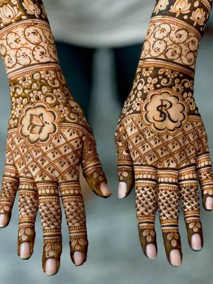 A clear, top-down view of Renuka's personalized bridal mehendi.