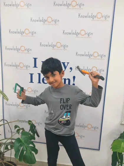 This camper is excited to get started with his tools. Providing real tools in a supervised setting builds a sense of responsibility and competence.