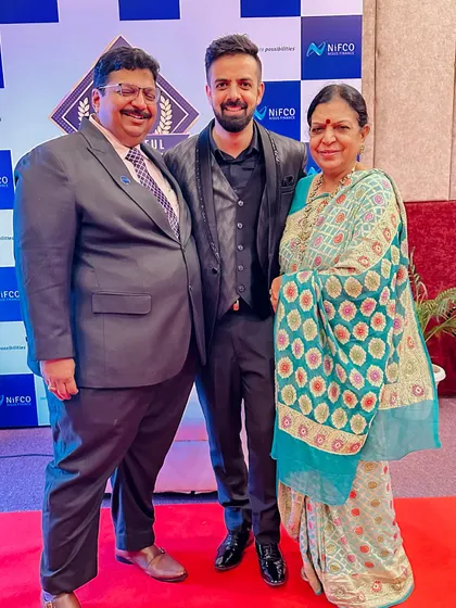 With my parents at the NIFCO 10th-anniversary event. Their support has been instrumental in my journey.