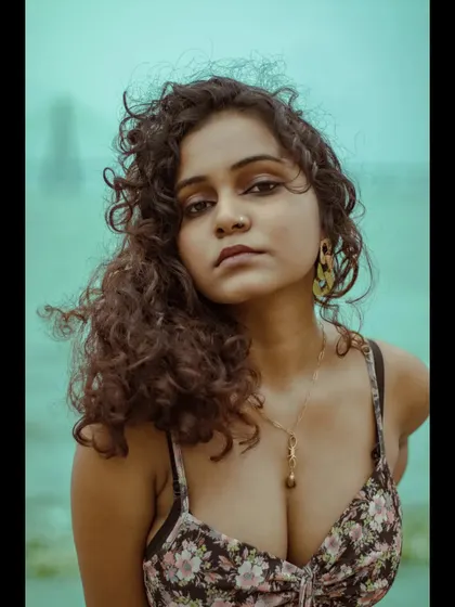 This is another strong close-up from the beach series. The composition focuses entirely on the model's face and expression, making it a compelling headshot option.