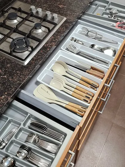 Every item in your kitchen, down to the last spoon, deserves a proper home. Using simple drawer dividers creates a system where you can find your cooking and dining cutlery in an instant.