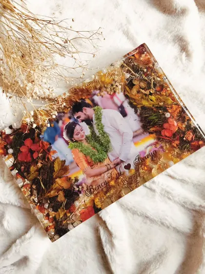 A close-up of the preserved Tulsi leaves and bright flowers, showing how old memories can be given new life.