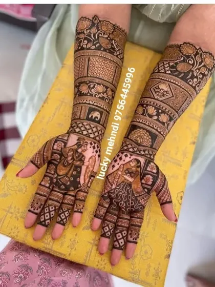 This design combines portraits with geometric patterns. The bride and groom are on the palms, while the arms feature a mix of traditional and Madhubani-style art.
