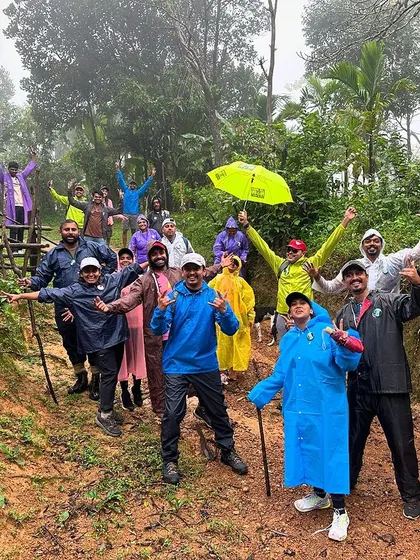A joyful group photo on a muddy trail during the Sharavathi trek. Rain or shine, the spirit of adventure is always high.