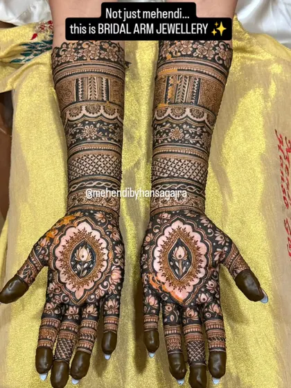 I believe bridal mehendi should feel like jewelry. This design features perfectly symmetrical patterns on both hands, with a central lotus motif and intricate bands that adorn the arms like timeless bracelets.
