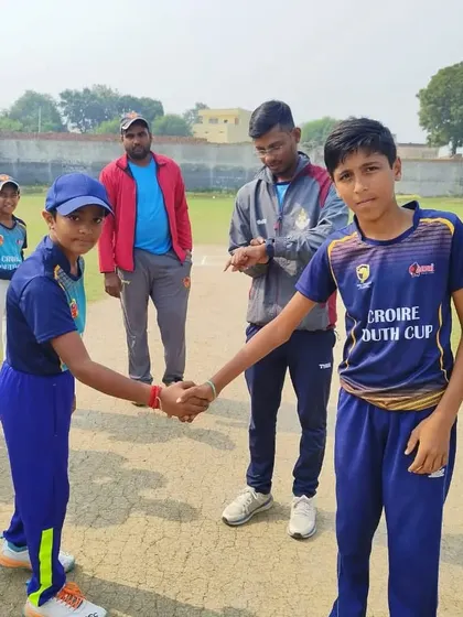 The pre-match handshake between captains at the Croire Youth Cup. Sportsmanship is a core value we instill.