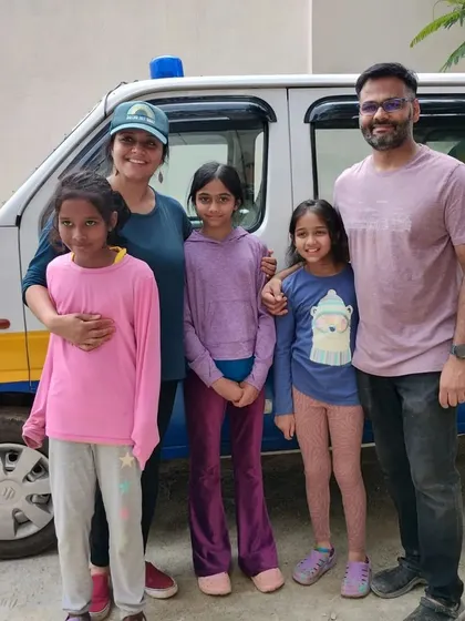 A family of supporters stands proudly in front of one of our pet ambulances. We are so thankful for families who teach their children about compassion and animal welfare.