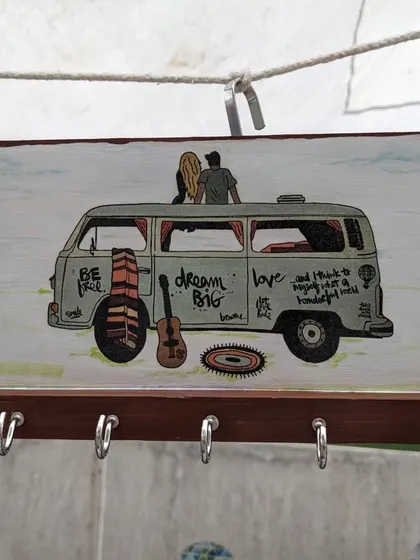 This wooden key holder with a "Dream Big" camper van theme is perfect for organizing your keys in a stylish way.