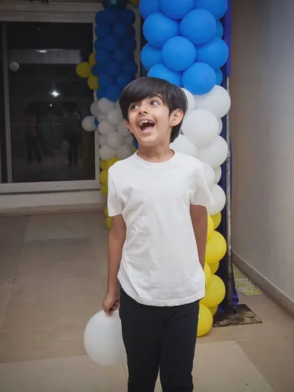 The look of pure wonder and excitement on a child's face at a party. My event photography focuses on capturing these genuine, expressive reactions.