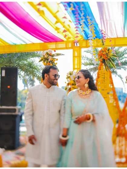 Palash and Palak sharing a sweet moment under the colorful decor of their Haldi ceremony. This shot highlights their connection and the beautiful, festive atmosphere of the day.