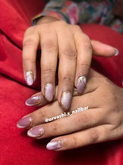 This collection showcases various cat-eye designs, from pink and gold glitter combinations to subtle shimmers with gold chrome tips. It highlights the versatility and enchanting effect of magnetic polishes.
