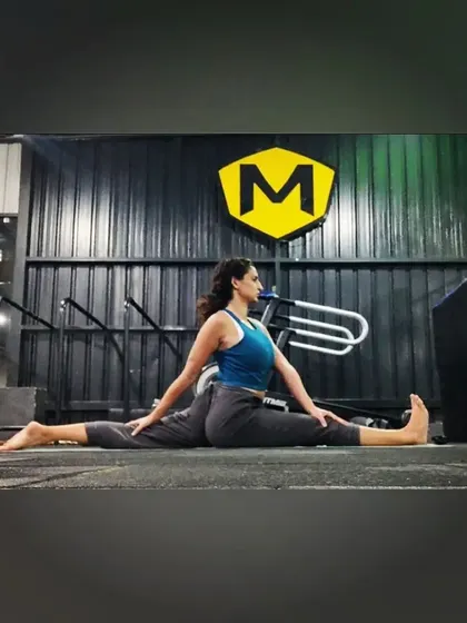 A side view of the front split, focusing on keeping the hips square. This is what I call somatic movement, where the focus is on the internal feeling of the stretch, not just the external look.