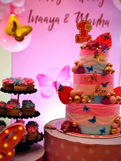 The beautiful multi-tiered cake from Inaaya and Manha's butterfly party. The cake itself is a work of art, perfectly matching the decor.