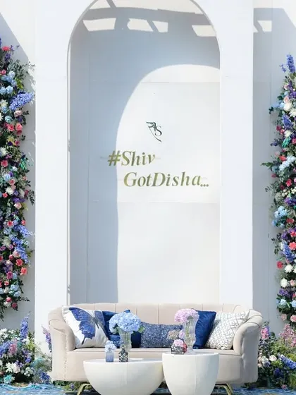 For a daytime event, I wanted to create a photo backdrop that was both fresh and breathtaking. This wall of flowers, with vertical columns of blue, purple, and white blooms, became a living piece of art for guests to enjoy.