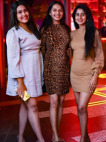 A fashionable trio posing for a picture. The crowd at my events always comes with great style and energy.