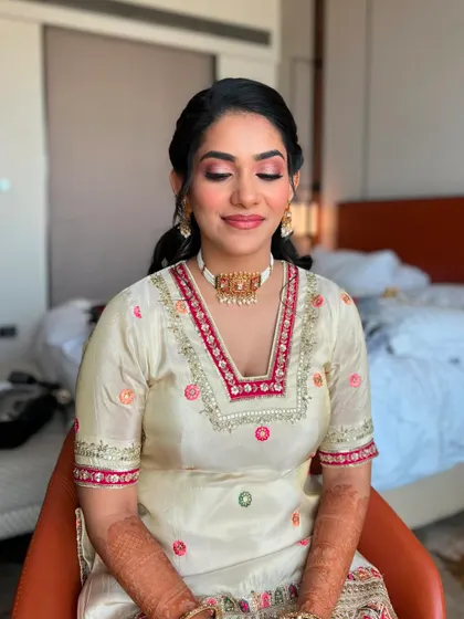 Eyes closed, you can see the soft pink eyeshadow we used for her Mehendi look.
