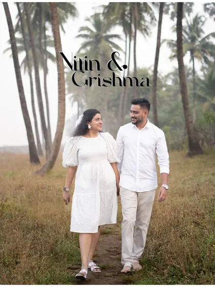 An elegant pre-wedding photo of a couple walking hand-in-hand through a misty grove of palm trees, creating a dreamy and romantic scene.