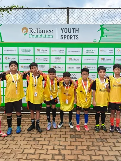 Our U11 team with their coach at a Reliance Foundation Youth Sports event.