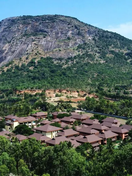A breathtaking aerial shot of the entire resort, showing the scale of our property and its unique location at the foothills of the magnificent Nandi Hills.