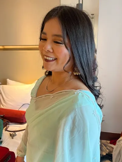 A candid shot showing her beautiful smile and the soft, glamorous makeup look.