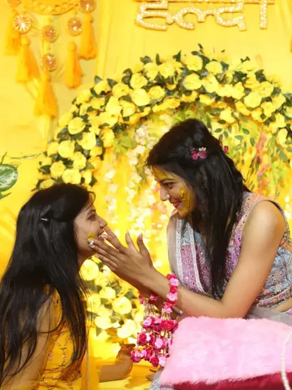 A playful, candid moment between sisters during the Haldi function. I am always looking for these small, joyful interactions that make for the most memorable photographs.