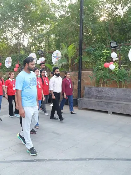 Walking with the staff and students at the Witty International School event. Community engagement is a core part of our mission.