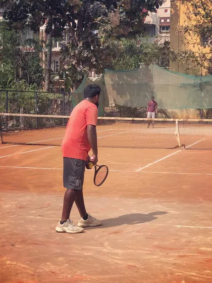 A player prepares to serve during a match in the Men's Open Tour.