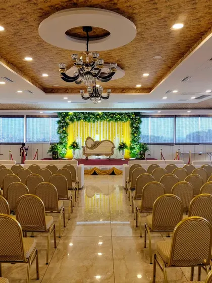 A wide shot of the hall with the yellow stage setup.