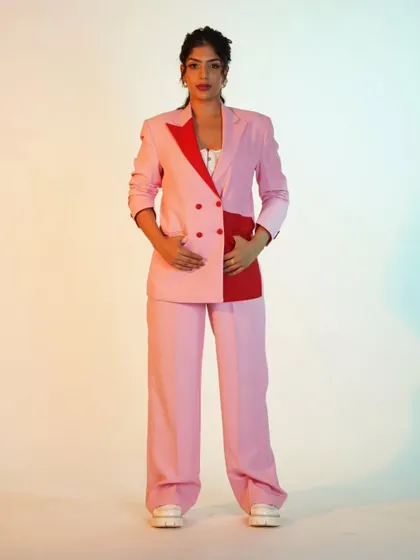 A pink and red color-blocked suit. It's a bold, fashion-forward choice for someone who isn't afraid to play with color.