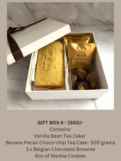 A perfect Rakhi gift for someone who loves variety. This hamper includes a full-sized tea cake (either Vanilla Bean or Banana Pecan), Belgian chocolate brownies, and a box of marble cookies.