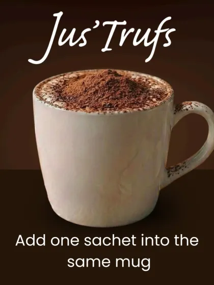 Our home Hot Chocolate Mix guide adds one sachet into the mug, shown here with chocolate powder above the drink.