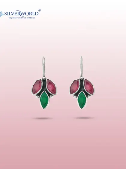 These unique drop earrings are crafted with faceted ruby-red and emerald-green stones in a leaf-like design. The sterling silver setting provides a beautiful contrast to the rich colors.
