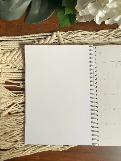 A blank page inside the spiral-bound planner, showing the high-quality paper and binding.