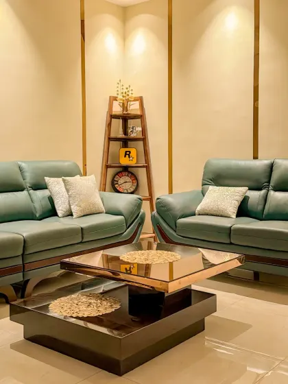 This beautifully appointed living room features our smart lighting system. The warm spotlights create a cozy atmosphere, and everything is controllable via a discreet smart panel on the wall.