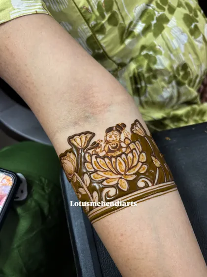 Another beautiful baby shower element, featuring baby Krishna nestled within a lotus flower, a symbol of purity and divinity.