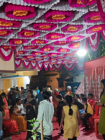 Guests mingling inside the pandal during a Haldi event.