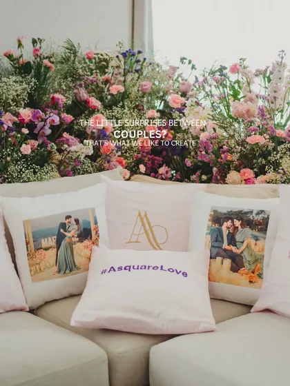 Customized pillows with the couple's photos, monogram, and wedding hashtag. These little surprises create a cozy and personalized lounge area for guests.