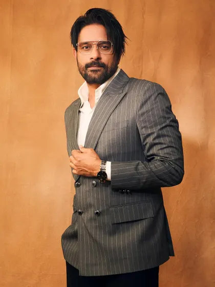 A confident pose that perfectly captures the essence of this sharp, tailored look. It’s all about feeling good in what you wear.