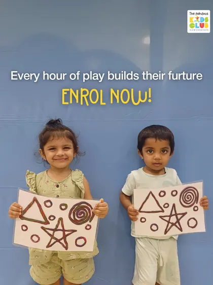 Every hour of play builds their future. These two proud artists are showing off their work, a result of a creative session that also built their confidence.